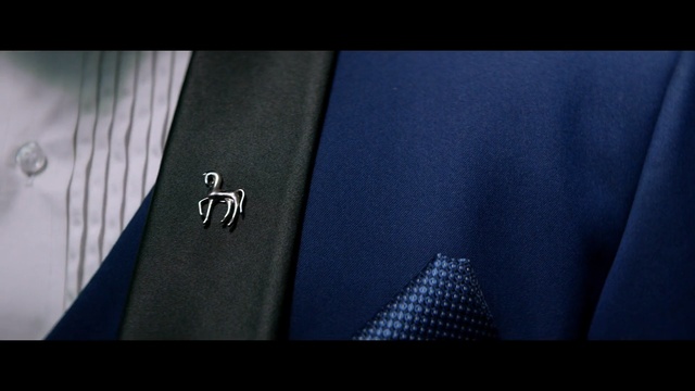 Video Reference: Blue, Suit, Jersey, Electric blue, Design, Font, Outerwear, Jacket, Pattern, Blazer
