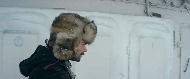 Video Reference: Fur, Person, Indoor, Man, Snow, Wearing, Holding, Black, Standing, Mirror, Reflection, Bed, Covered, Water, Hat, Skiing, Human face, Clothing