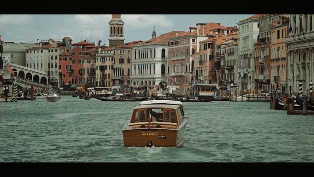 Video Reference: waterway, canal, water transportation, gondola, town, sky, water, channel, city, vehicle