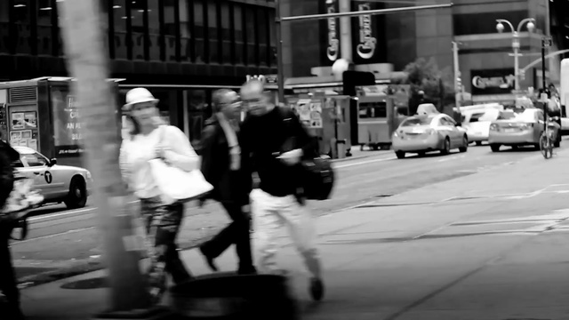 Video Reference: White, Photograph, Black, Black-and-white, Street, Monochrome, Snapshot, Standing, Pedestrian, Mode of transport
