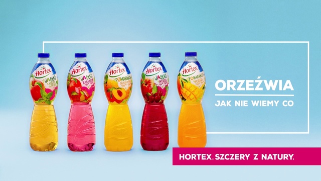 Video Reference: Plastic bottle, Orange soft drink, Drink, Orange drink, Soft drink, Bottle, Non-alcoholic beverage, Carbonated soft drinks, Water bottle, Sports drink, Different, Holding, Food, Group, Player, White, Text