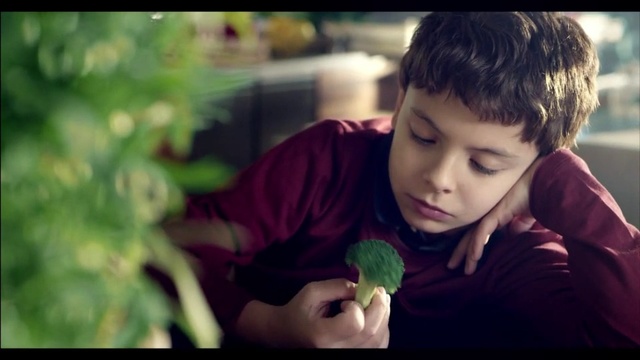 Video Reference: Green, Child, Leaf, Snapshot, Broccoli, Smile, Eye, Leaf vegetable, Lip, Human