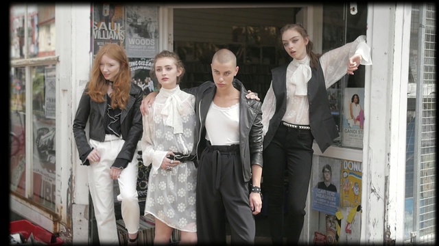 Video Reference: fashion, girl, street, event, road, Person