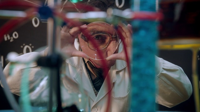 Video Reference: Glasses, Snapshot, Eyewear, Human, Fun, Eye, Cool, Mouth, Photography, Flesh, Person, Building, Woman, Cellphone, Phone, Looking, Lady, Using, Front, Red, Wearing, Holding, Standing, Man, Close, Hair, Table, Glass, Head, Blue, Talking, Street, White, Human face, Colored