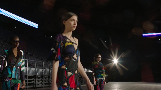 Video Reference: Fashion, Performance, Beauty, Dancer, Event, Fashion design, Performing arts, Night, Dance, Performance art, Person, Young, Woman, Standing, Holding, Playing, Girl, Room, Man, Front, Boy, Video, People, Walking, Living, Game, Table, Board, Umbrella, Street, Group, Luggage, Riding, Clothing, Human face, Crowd