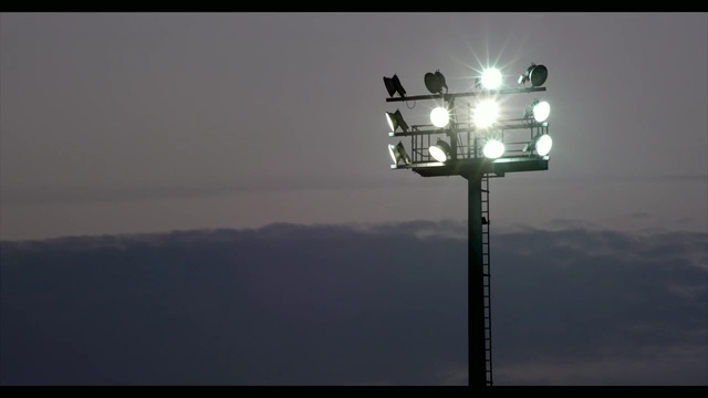 Video Reference: sky, light, light fixture, street light, lighting, atmosphere, cloud, daytime, energy, darkness, Person