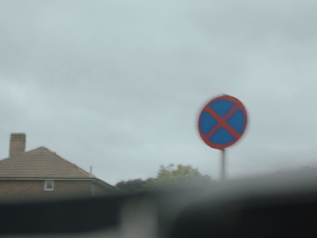 Video Reference: sky, cloud, traffic sign, signage, sign, flag, meteorological phenomenon