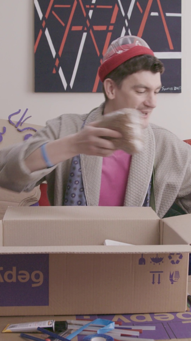 Video Reference: Cap, Shipping box, Package delivery, Gesture, Baseball cap, Packing materials, Carton, Event, Box, Packaging and labeling