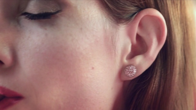 Video Reference: cheek, earrings, eyebrow, lip, ear, nose, chin, close up, eyelash, forehead, Person