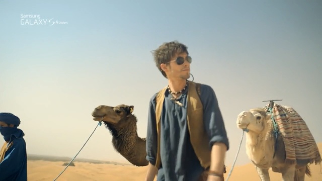 Video Reference: camel, camel like mammal, arabian camel, sahara, desert, landscape, aeolian landform, sky, livestock, tourism, Person