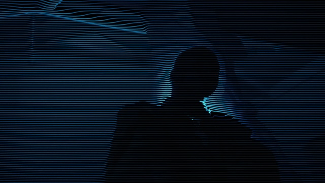 Video Reference: Font, Tints and shades, Electric blue, Symmetry, Backlighting, Pattern, Darkness, Event, Shadow, Visual arts