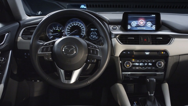 Video Reference: Land vehicle, Vehicle, Car, Steering wheel, Center console, Sedan, Subcompact car, Person