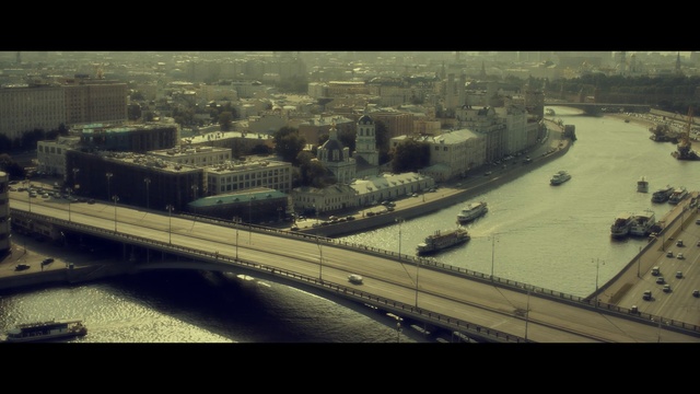 Video Reference: urban area, aerial photography, city, bridge, road, fixed link, sky, tree, bird's eye view, metropolis