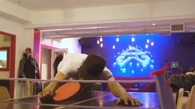 Video Reference: room, fun, sport venue, entertainment, display device, indoor games and sports, recreation room, interior design, play, leisure, Person