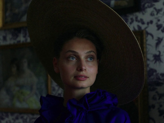 Video Reference: Lip, Hairstyle, Eyebrow, Fedora, Hat, Flash photography, Eyelash, Purple, Iris, Headgear