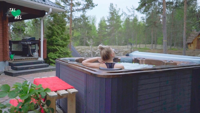 Video Reference: Jacuzzi, Leisure, Backyard, Deck, Room, Patio, Fawn, Person, Outdoor, Table, Building, Food, Window, House, Picnic, Sitting, Small, Standing, Large, Wooden, Woman, Cage, Glass, Holding, Plate, Eating, Red, Pink, Living, Bird, Pizza, White, Tree, Furniture, Bench, Clothing, Porch