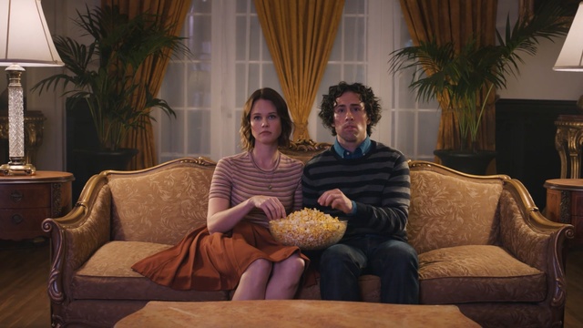 Video Reference: furniture, sitting, room, couch, home, house, interior design, fun, conversation, family, Person