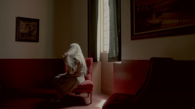 Video Reference: room, sitting, light, darkness, furniture, lighting, window, interior design, girl, couch
