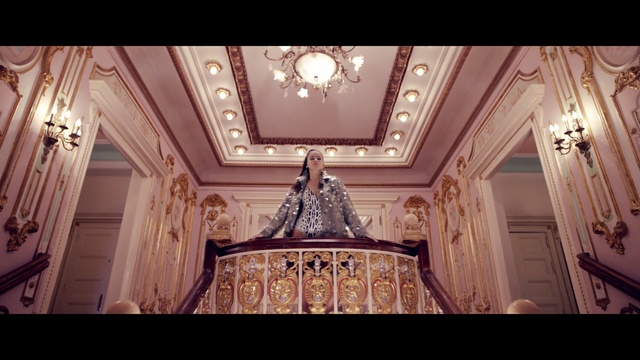 Video Reference: Ceiling, Lighting, Light fixture, Architecture, Chandelier, Building, Room, Interior design, Symmetry, Molding, Person