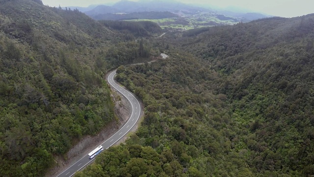 Video Reference: road, mountainous landforms, mountain pass, vegetation, highland, wilderness, hill station, mountain, nature reserve, forest