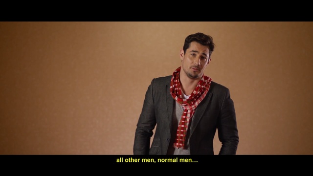 Video Reference: Gentleman, Facial hair, Fun, Formal wear, Tie, Beard, Photography, Suit, Neck, Smile, Person, Man, Indoor, Holding, Posing, Front, Standing, Black, Wearing, Board, Suitcase, Woman, Shirt, Young, Smiling, Dressed, Large, Table, Computer, Water, Luggage, White, Human face, Wall, Text, Screenshot, Fashion accessory, Clothing, Necklace, Male