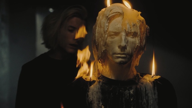 Video Reference: Sculpture, Head, Lighting, Art, Human, Statue, Carving, Darkness, Nature, Person, Fire, Looking, Front, Dark, Building, Cake, Fireplace, Standing, Man, Lit, Woman, Sitting, Table, Black, Holding, Yellow, Red, Street, Human face