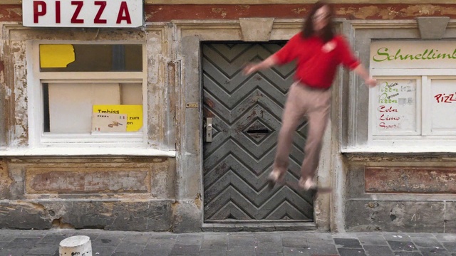 Video Reference: Red, Wall, Door, Outerwear, Brickwork, Street fashion, Facade, Brick, Window