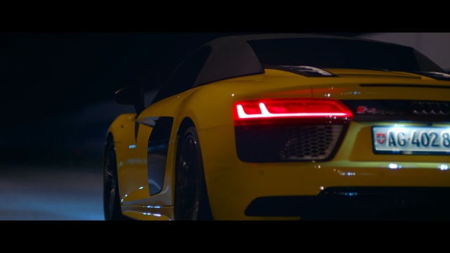 Video Reference: car, land vehicle, sports car, vehicle, yellow, automotive design, motor vehicle, mode of transport, audi r8, performance car