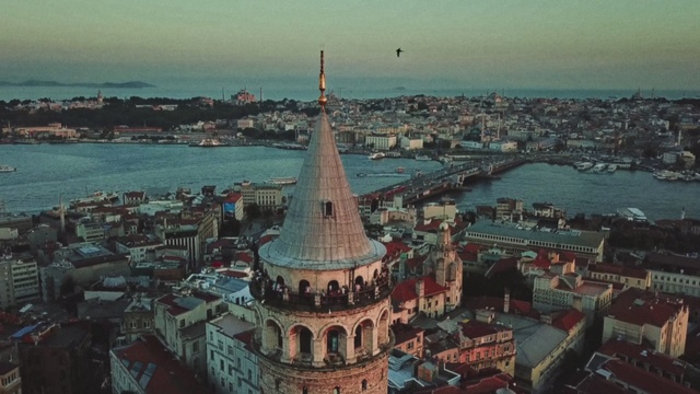 Video Reference: Landmark, Tower, City, Spire, Metropolitan area, Town, Human settlement, Architecture, Urban area, Cityscape