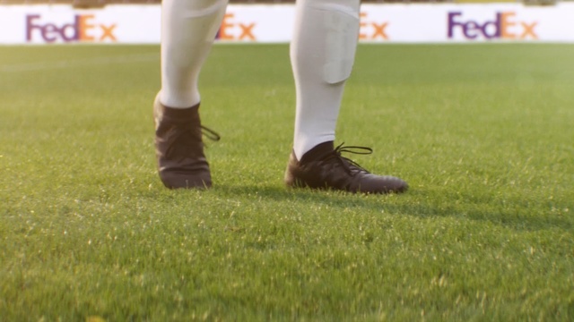 Video Reference: footwear, grass, shoe, lawn, plant, games, sports, ball game, player, recreation