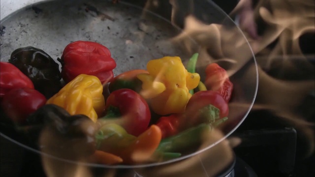 Video Reference: Food, Cuisine, Dish, Confectionery, Ingredient, Sweetness, Still life photography, Plant, Photography, Vegetable, Person, Indoor, Fruit, Bowl, Filled, Table, Banana, Plate, Sitting, Pan, Holding, Counter, Salad, Blender, Kitchen, Silver, Candy, Bell pepper, Bell peppers and chili peppers, Gummi candy, Tomato, Capsicum, Sliced