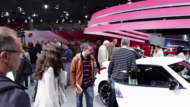 Video Reference: Land vehicle, Auto show, Vehicle, Car, Automotive design, Exhibition, Luxury vehicle, Event, Concept car, Compact car, Person