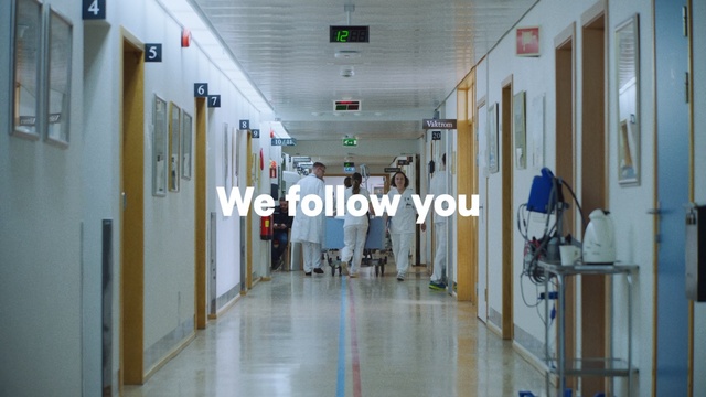 Video Reference: Product, Ceiling, Hospital, Floor, Building, Door, Flooring, Room, Hall, Glass, Person