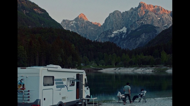 Video Reference: Sky, Mountain, Water, Vehicle, Nature, Tire, Plant, Tree, Lake, Bank