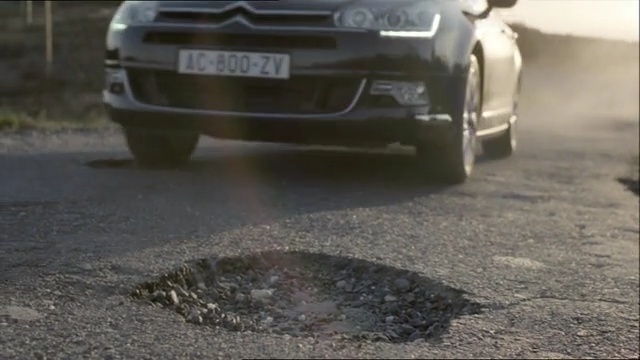 Video Reference: car, motor vehicle, vehicle, asphalt, mode of transport, vehicle registration plate, family car, mid size car, road, city car