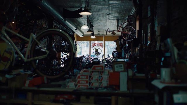 Video Reference: Urban area, Darkness, Room, Architecture, City, Bicycle wheel, Vehicle, Building, Night, Spoke