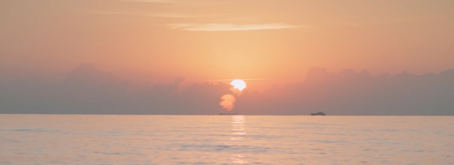 Video Reference: horizon, sunrise, sky, calm, sea, sun, sunset, morning, water, atmosphere