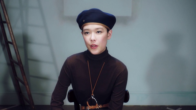 Video Reference: Face, Beanie, Head, Cap, Male, Headgear, Photography, Cool, Neck, Fashion accessory, Person, Indoor, Boy, Young, Wearing, Standing, Holding, Hat, Little, Small, Child, Front, Black, Posing, Man, Table, Kitchen, Board, Computer, Room, Baseball, Laptop, Cake, Shirt, Wall, Human face, Clothing, Necklace, Portrait