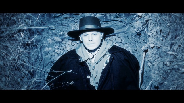 Video Reference: Hat, Sun hat, Flash photography, Fedora, Tints and shades, Font, Tree, Electric blue, Darkness, Costume hat