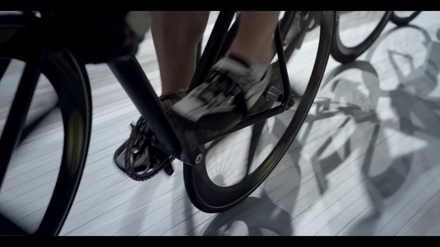 Video Reference: Bicycle part, Footwear, Bicycle, Bicycle wheel, Spoke, High heels, Leg, Shoe, Bicycle tire, Black-and-white