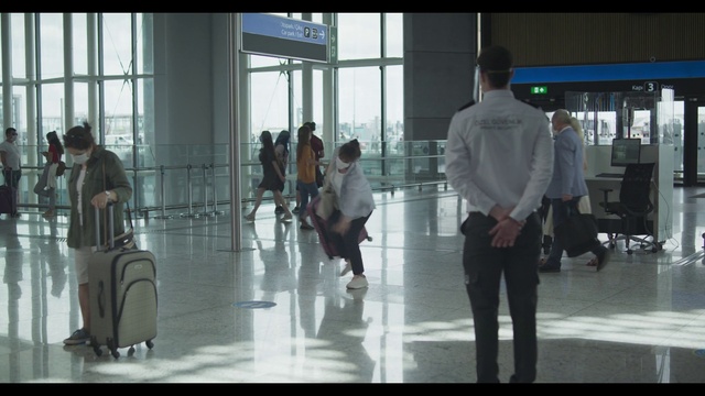 Video Reference: Footwear, Trousers, Standing, Luggage and bags, Building, Bag, Travel, Flooring, Cleanliness, Glass