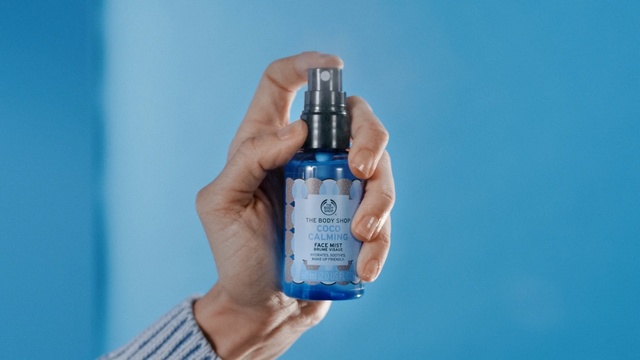 Video Reference: blue, product, product, bottle, nail, finger, hand, liquid, spray