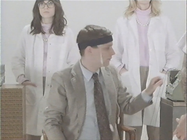 Video Reference: suit, outerwear, fashion, girl, top, sleeve, formal wear, uniform, dress shirt, shirt, Person