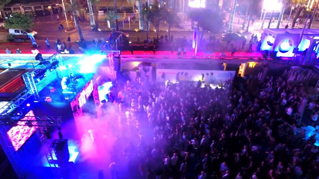 Video Reference: crowd, entertainment, rock concert, stage, nightclub, disco, concert, audience, music venue, event, Person