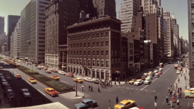 Video Reference: Car, Building, Vehicle, Skyscraper, Urban design, Architecture, Mode of transport, Tower block, Sky, Thoroughfare