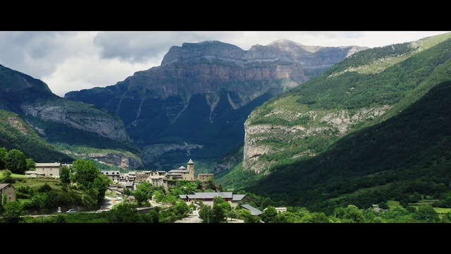 Video Reference: Sky, Mountain, Cloud, Green, Natural landscape, Building, Slope, Terrain, Travel, Landscape