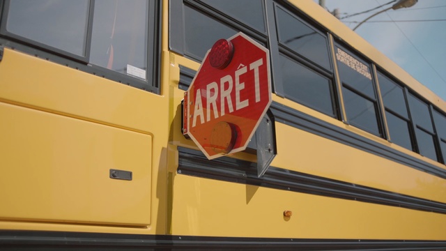 Video Reference: yellow, motor vehicle, bus, vehicle, transport, school bus, railroad car, signage, public transport, line