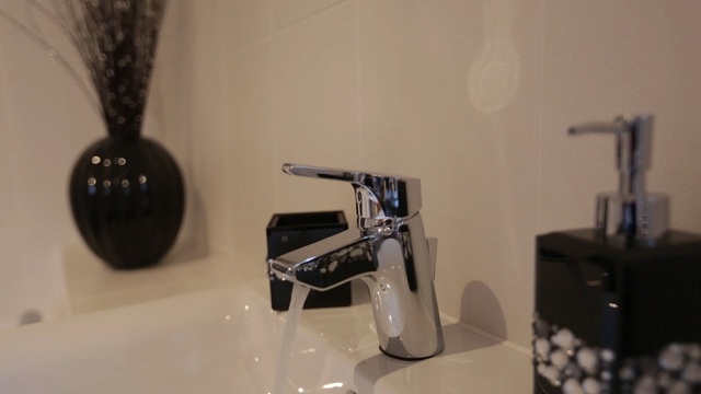 Video Reference: tap, plumbing fixture, bathroom, sink, flooring, Person