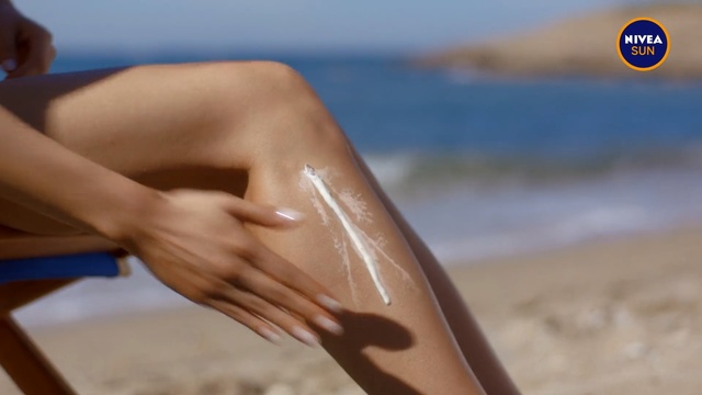 Video Reference: Skin, Sun tanning, Arm, Sand, Tan, Hand, Joint, Summer, Vacation, Elbow, Person, Beach, Woman, Board, Water, Table, Sitting, Holding, Wooden, Young, Close, Girl, Surfing, Cake, Man, White, Laying, Ocean, People, Ball, Playing, Standing, Swimsuit, Swimwear