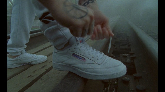 Video Reference: footwear, white, sneakers, shoe, cool, leg, outdoor shoe, walking shoe, hand, foot